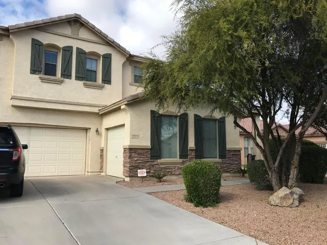 a front view of a house with parking
