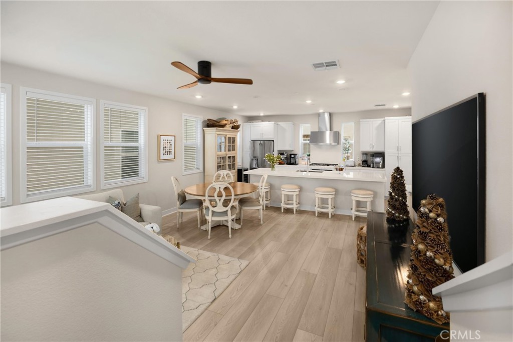 26 Crown Point Drive Rancho Mission Viejo, CA 92694 - Photo 12 of 42 a large kitchen with a table and chairs