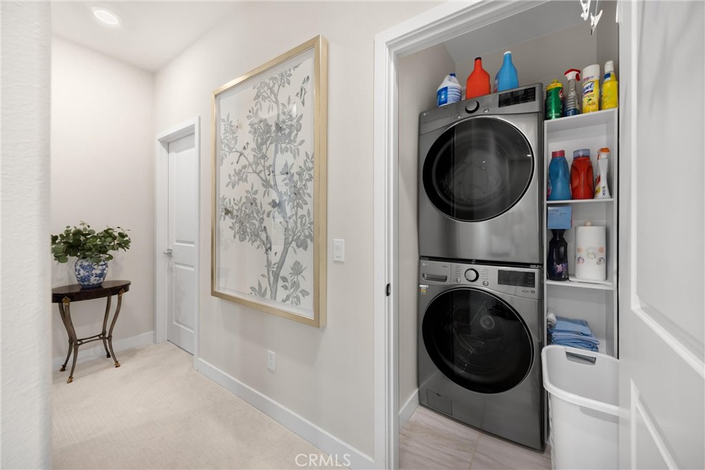 26 Crown Point Drive Rancho Mission Viejo, CA 92694 - Photo 17 of 42 a view of a hallway with washer and dryer