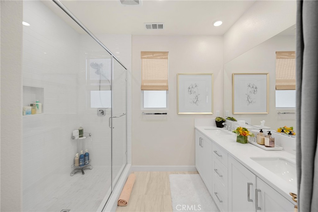 26 Crown Point Drive Rancho Mission Viejo, CA 92694 - Photo 19 of 42 a bathroom with a tub sink a mirror and shower