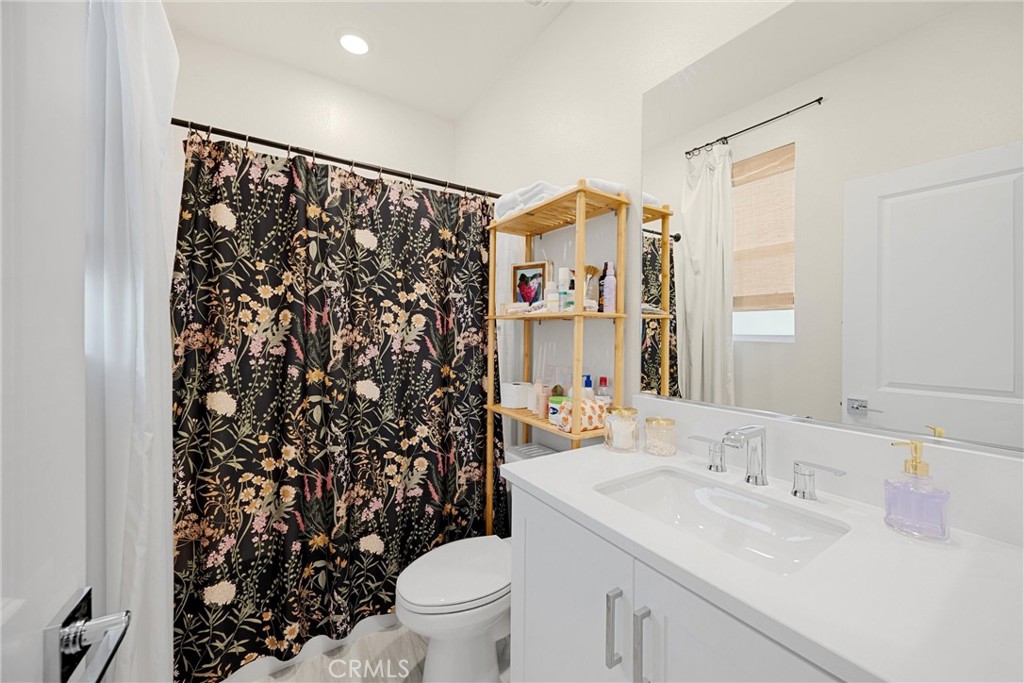 26 Crown Point Drive Rancho Mission Viejo, CA 92694 - Photo 22 of 42 a bathroom with a sink toilet and shower