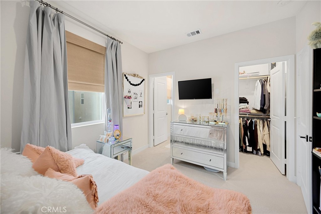 26 Crown Point Drive Rancho Mission Viejo, CA 92694 - Photo 23 of 42 a bedroom with a bed and a flat screen tv