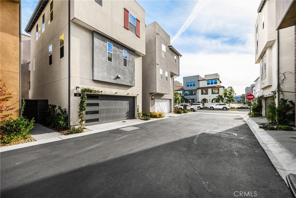 26 Crown Point Drive Rancho Mission Viejo, CA 92694 - Photo 40 of 42 a city street with tall buildings