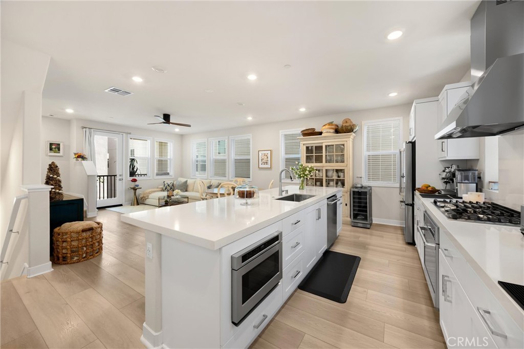 26 Crown Point Drive Rancho Mission Viejo, CA 92694 - Photo 8 of 42 a large kitchen with stainless steel appliances lots of counter space and a sink