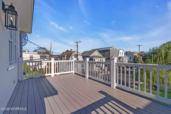 a view of a balcony with wooden floor
