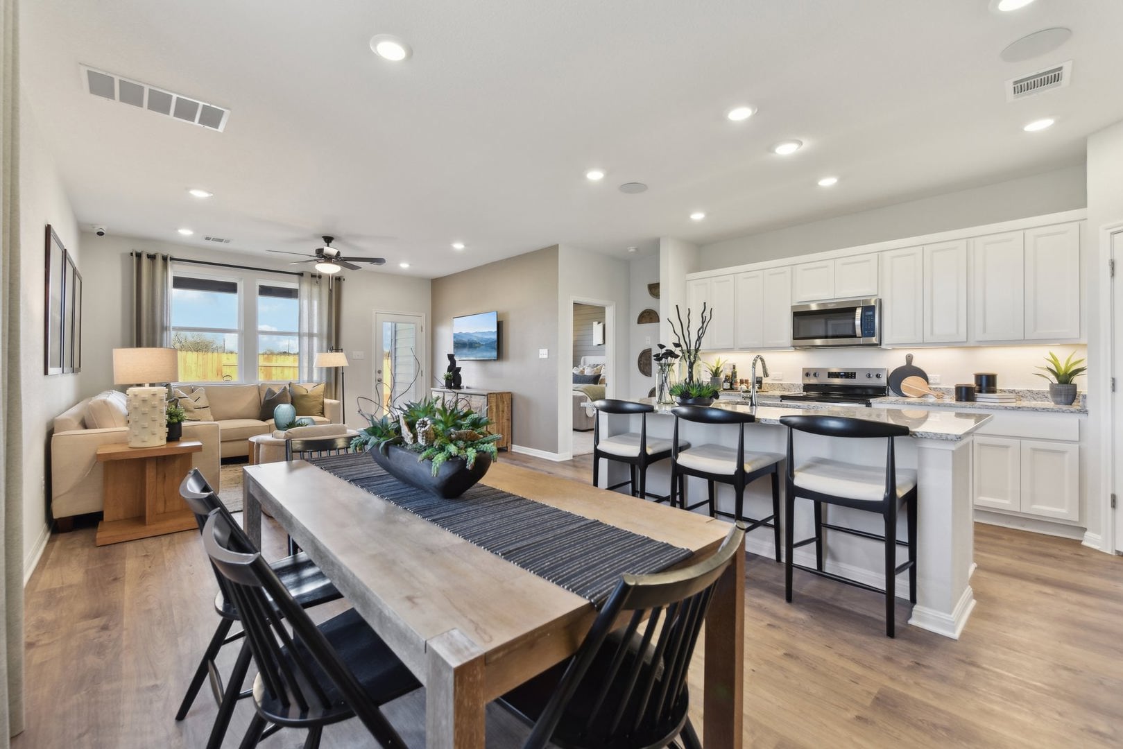 253 Firefox Way Jarrell, TX 76537 - Photo 17 of 17 An open floorplan seamlessly connects the dining area, living space, and a well-appointed kitchen.