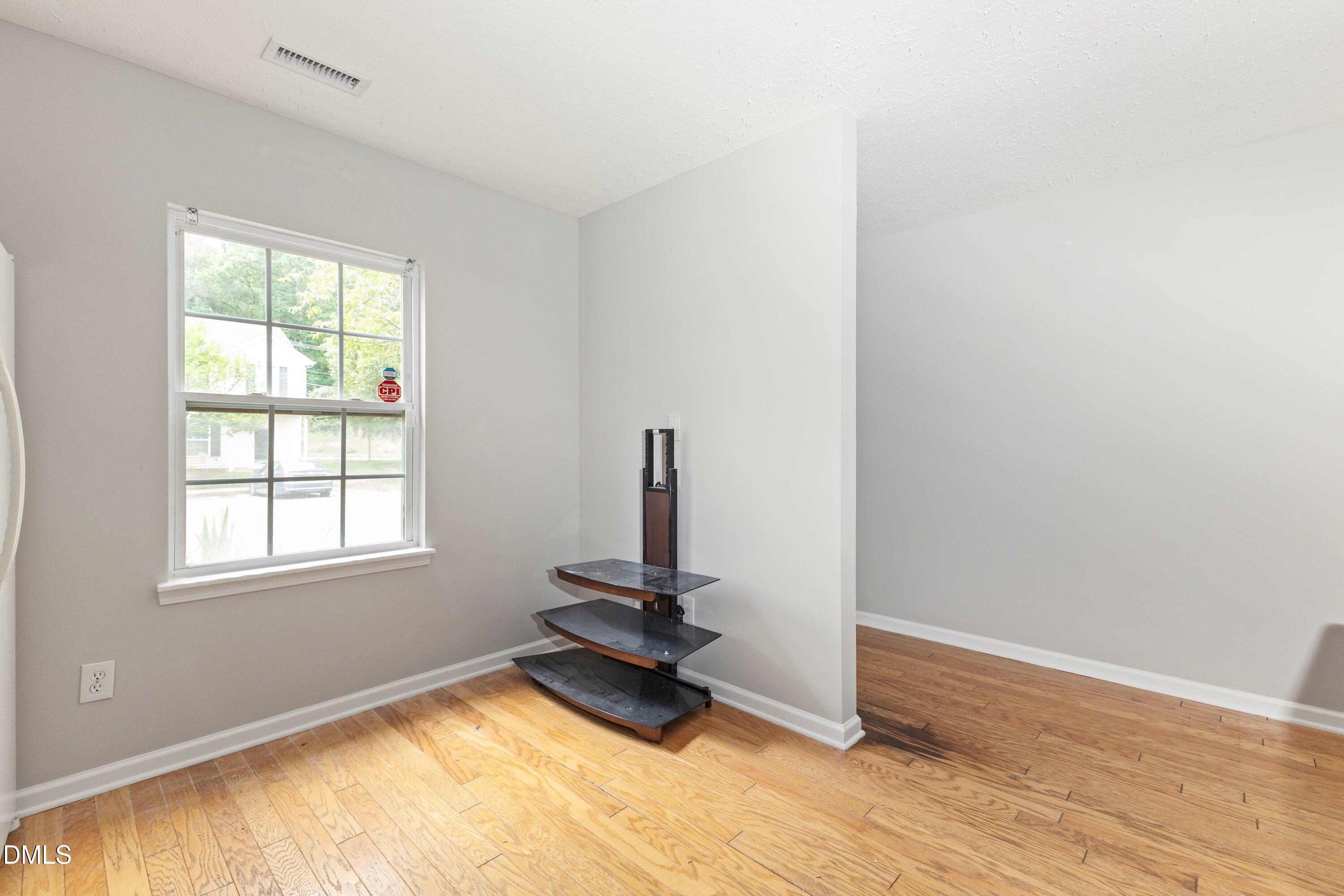 3358 Tarleton West Durham, NC 27713 - Photo 8 of 23 a view of a room with gym equipment and a window