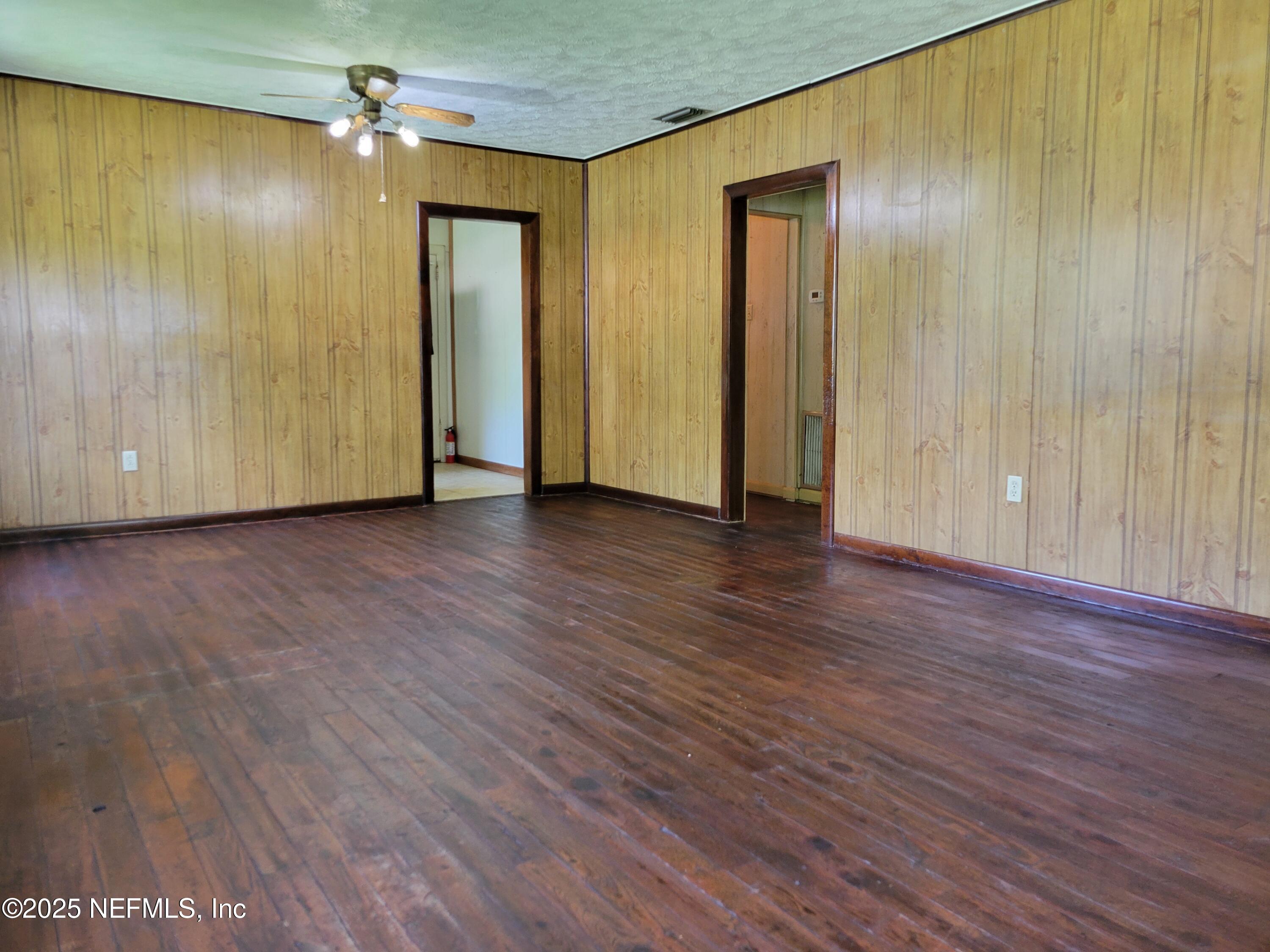 762 North Walnut Street Starke, FL 32091 - Photo 13 of 38 an empty room with wooden floor and closet