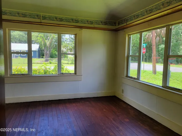 a view of a room that has a large window