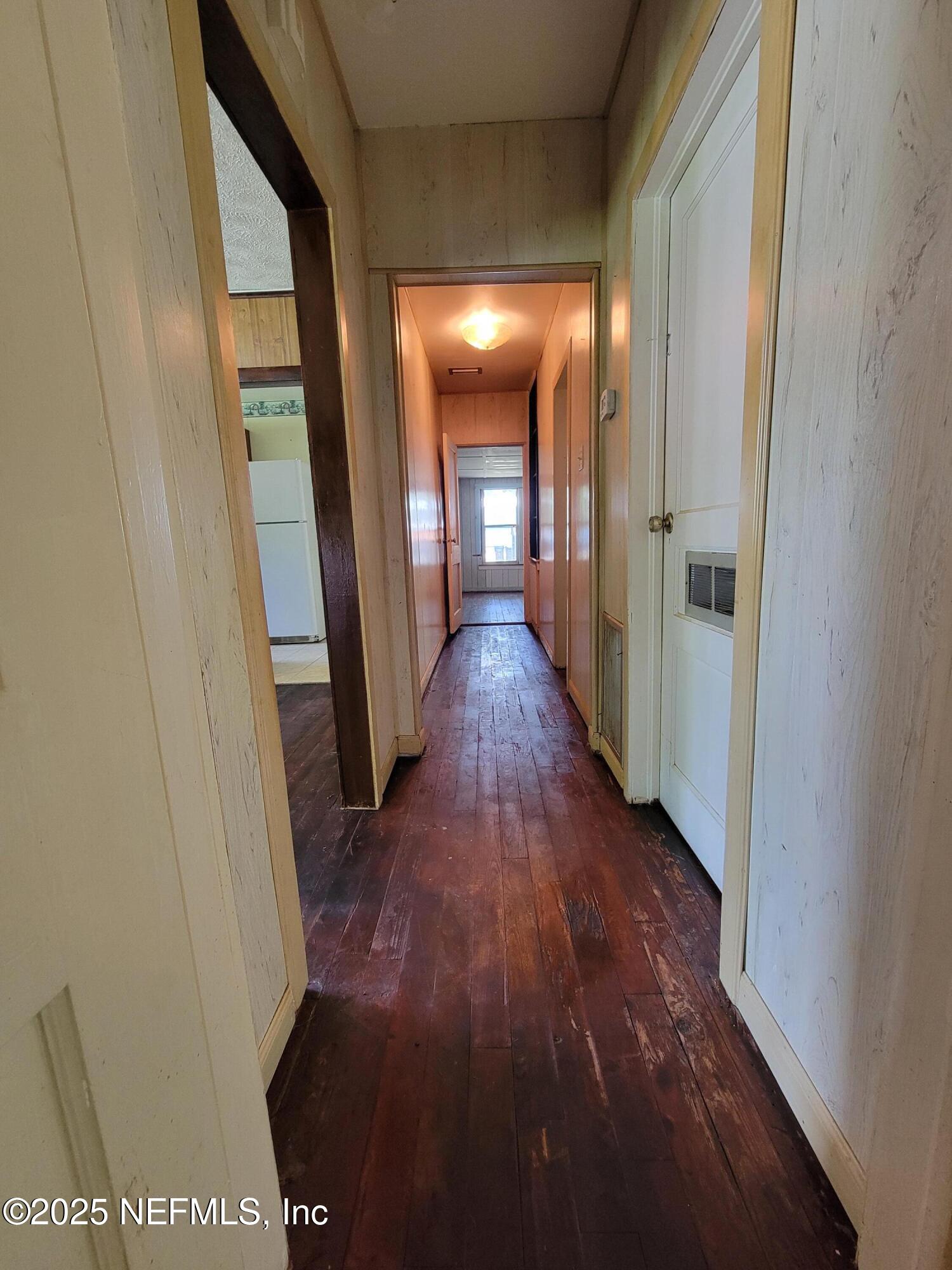 762 North Walnut Street Starke, FL 32091 - Photo 20 of 38 a view of a hallway with wooden floor