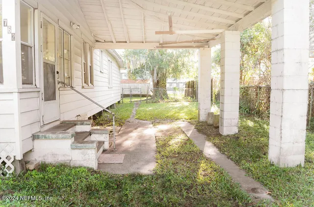 a view of a porch with a yard