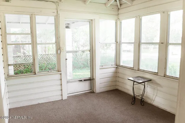 a room with furniture and a window