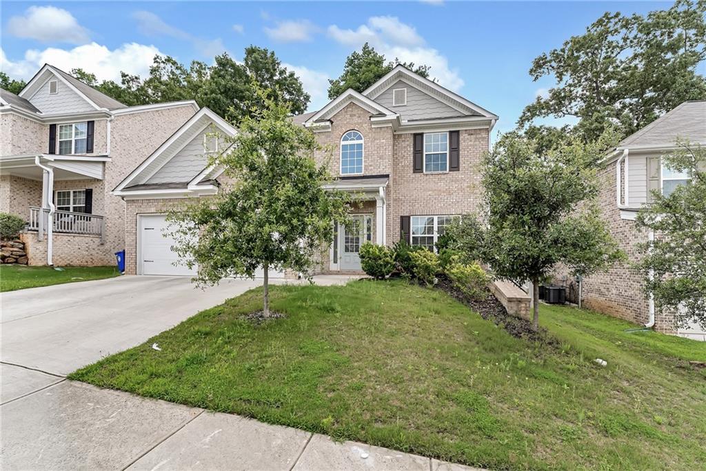 front view of a house with a yard