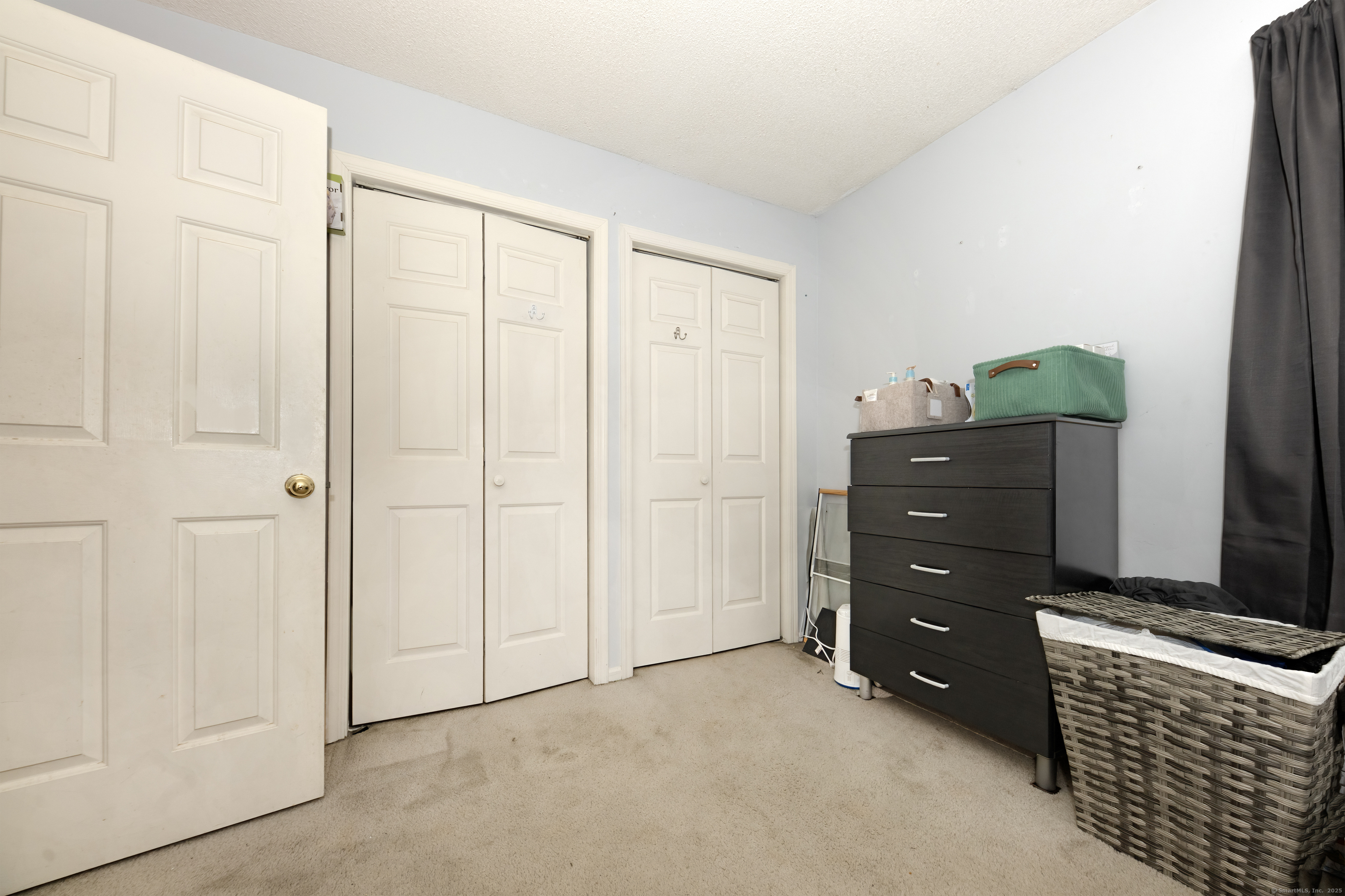 53 Brushy Plain Road, Unit 4E Branford, CT 06405 - Photo 17 of 24 a room with a dresser and a window