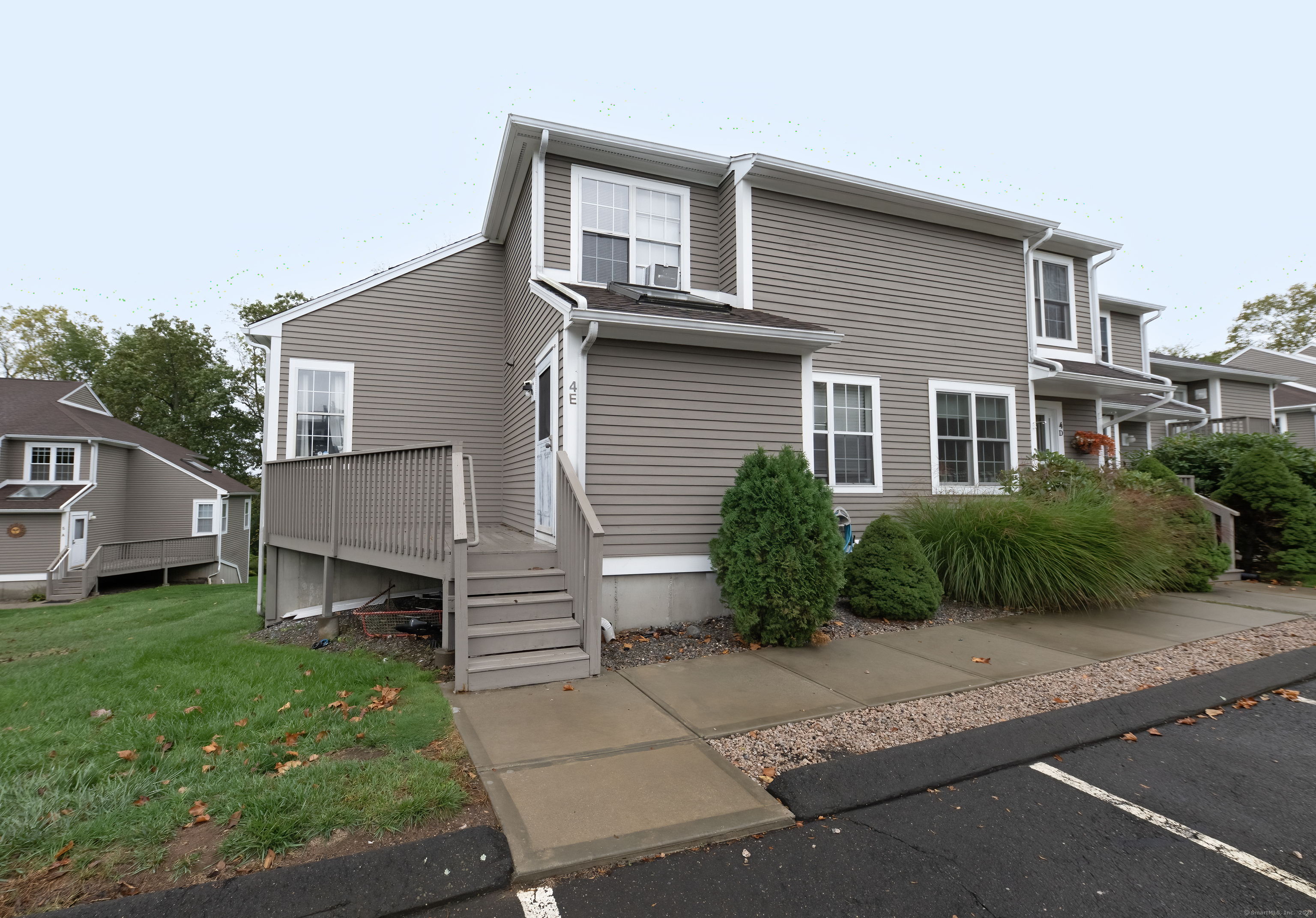53 Brushy Plain Road, Unit 4E Branford, CT 06405 - Photo 2 of 24 a house that has a lot of plants in it