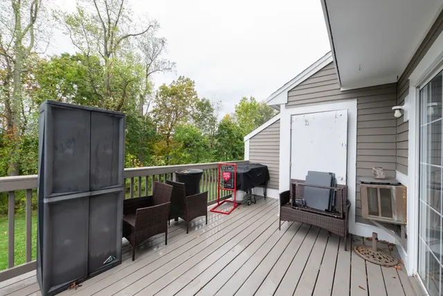 a view of balcony with deck and wooden floor