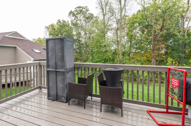 a view of balcony with wooden floor and outdoor seating