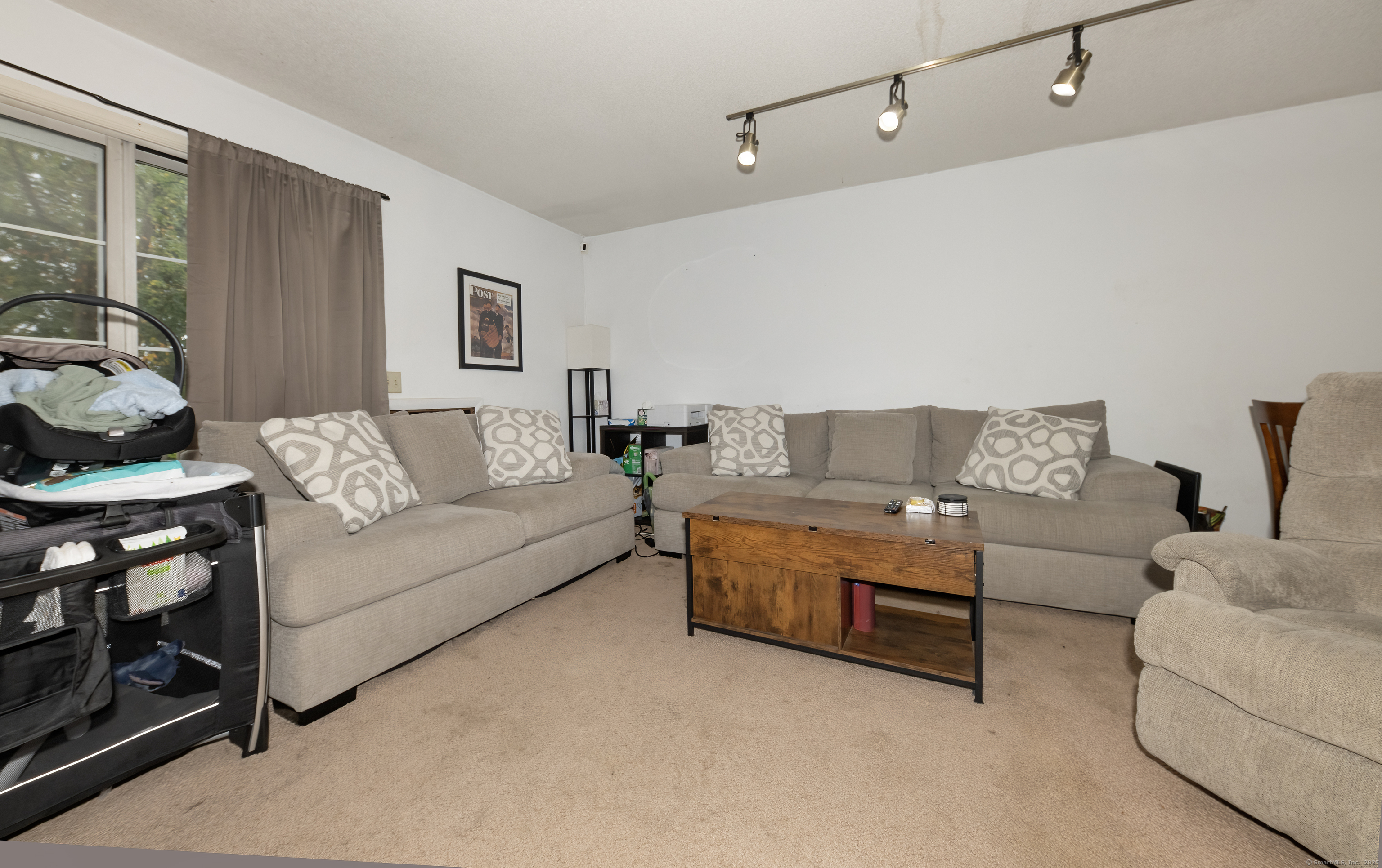 53 Brushy Plain Road, Unit 4E Branford, CT 06405 - Photo 8 of 24 a living room with furniture and a couch