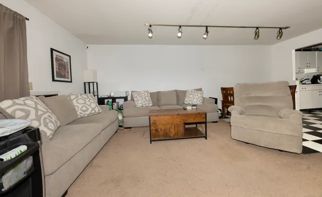 a living room with furniture and a couch