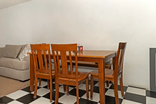 a balcony with chairs and table