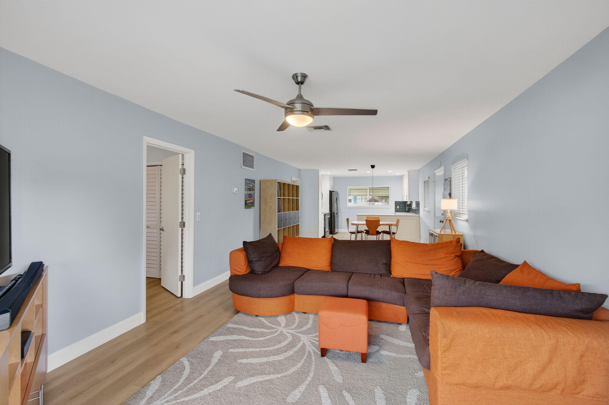 632 Hummingbird Lane Delray Beach, FL 33445 - Photo 14 of 60 a living room with furniture and a chandelier