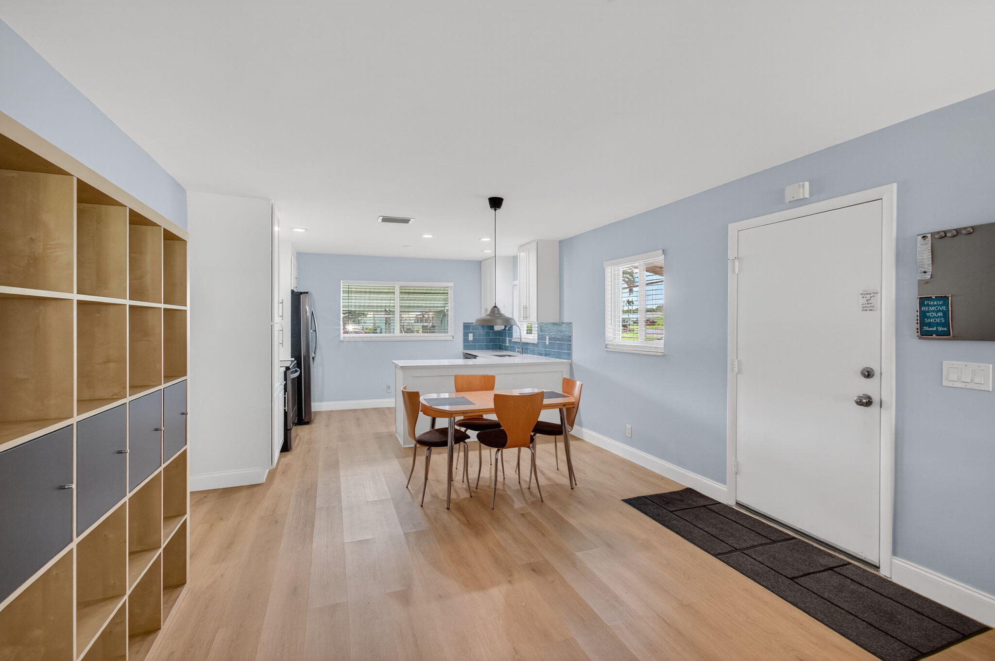 632 Hummingbird Lane Delray Beach, FL 33445 - Photo 15 of 60 a dining room with furniture and chandelier