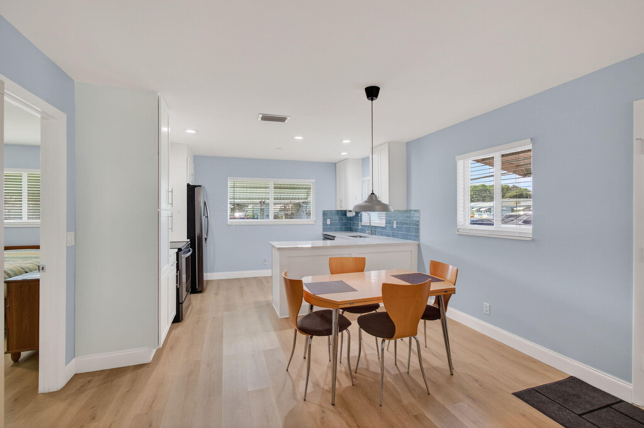632 Hummingbird Lane Delray Beach, FL 33445 - Photo 16 of 60 a dining room with furniture and window