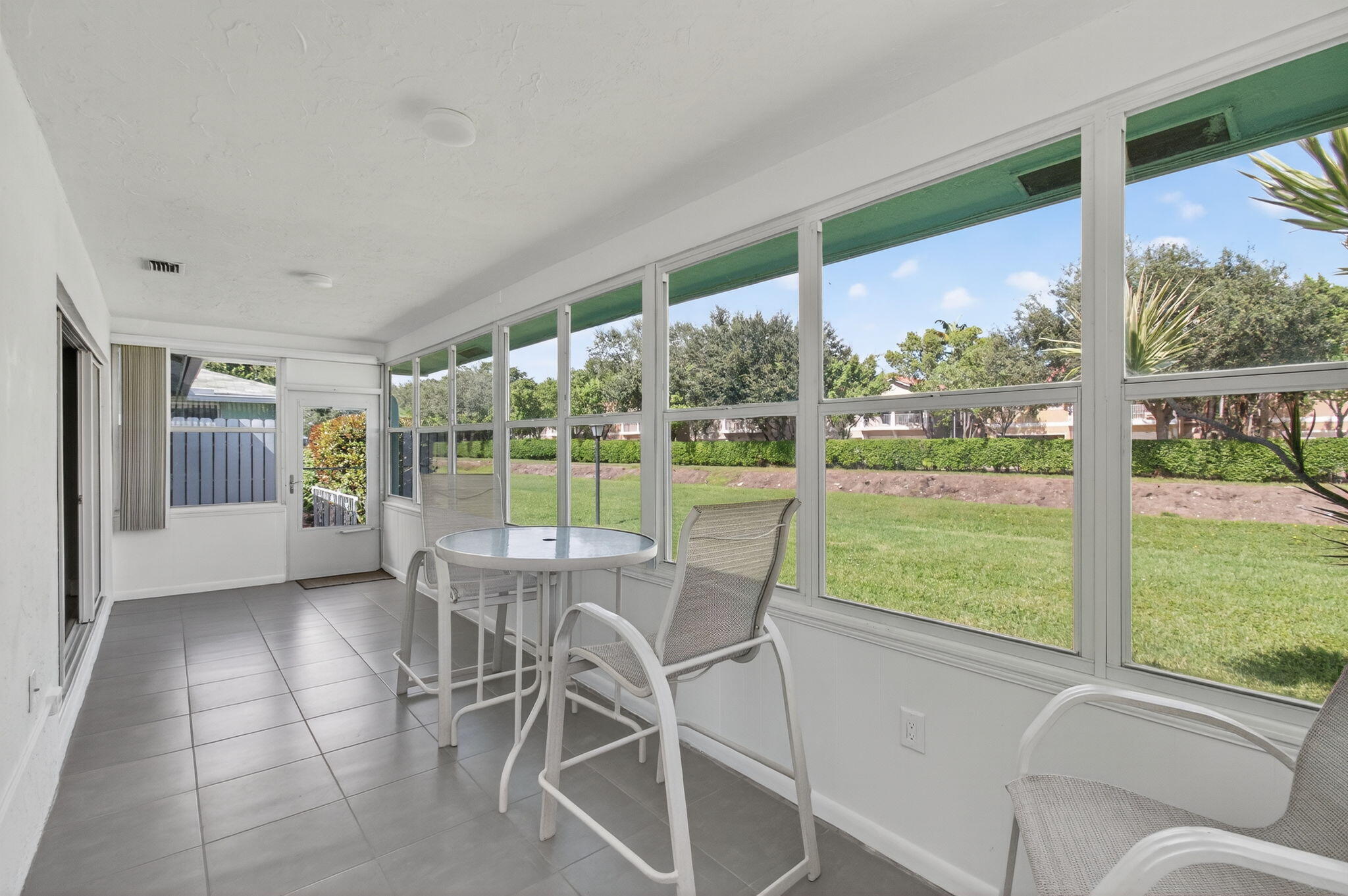 632 Hummingbird Lane Delray Beach, FL 33445 - Photo 29 of 60 a dining room with furniture water view and balcony