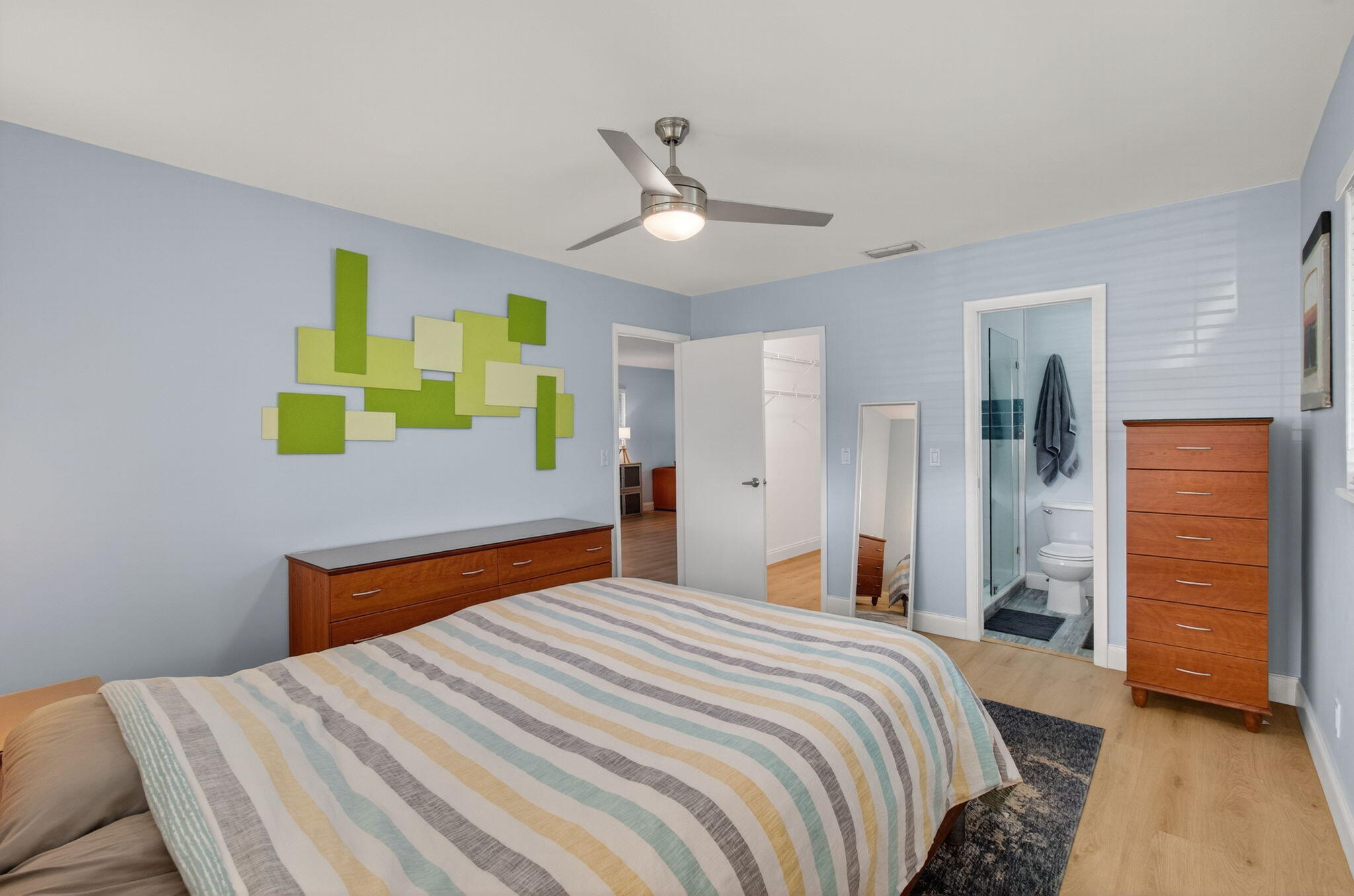 632 Hummingbird Lane Delray Beach, FL 33445 - Photo 33 of 60 a bedroom with a bed and a dresser