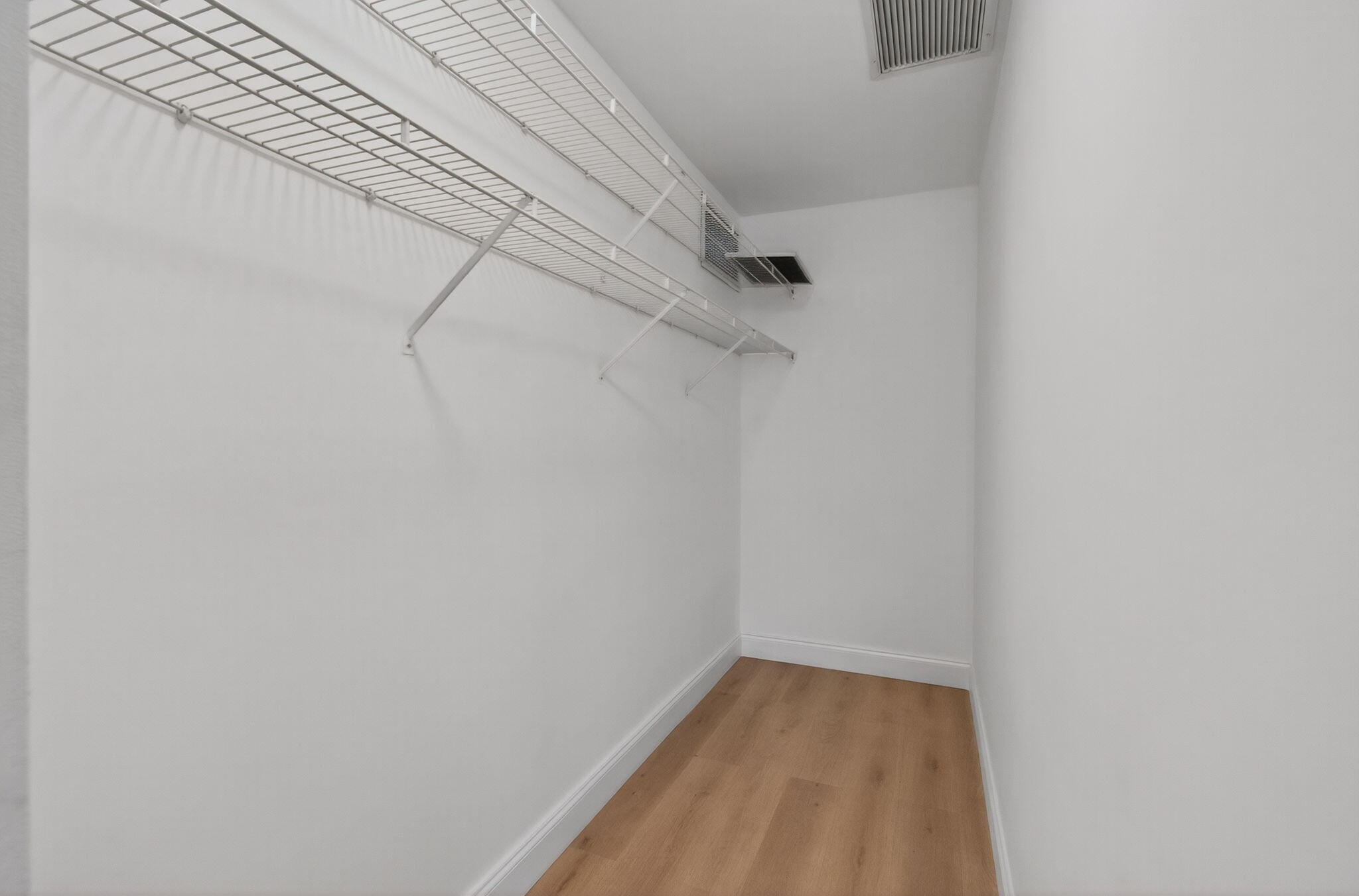 632 Hummingbird Lane Delray Beach, FL 33445 - Photo 35 of 60 a view of a room with racks on the wall