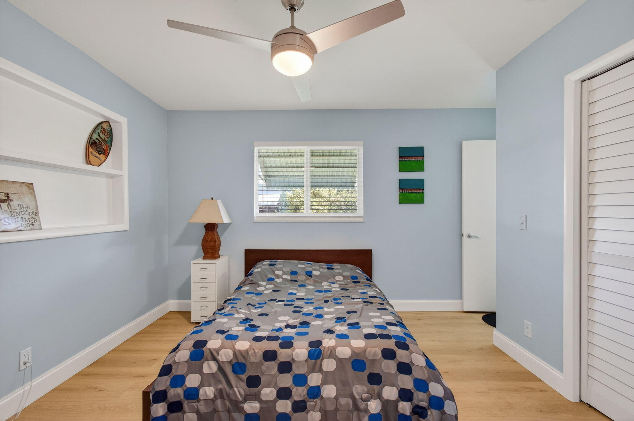 632 Hummingbird Lane Delray Beach, FL 33445 - Photo 41 of 60 a bedroom with a bed and a window