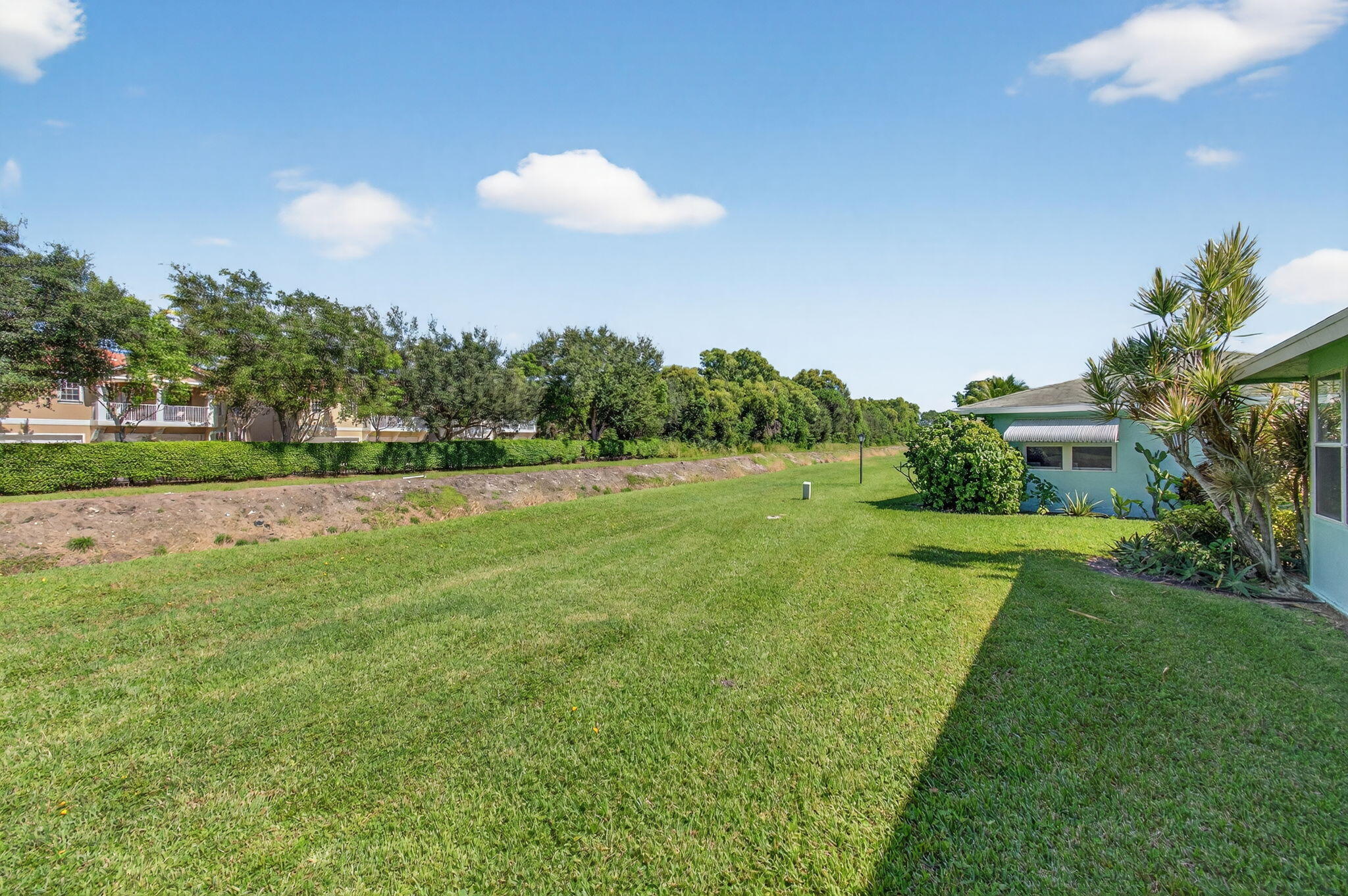 632 Hummingbird Lane Delray Beach, FL 33445 - Photo 60 of 60 a view of a golf course with a lake