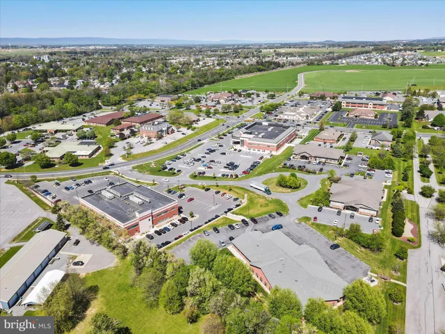 a kitchen with a sink a stove and a fireplace