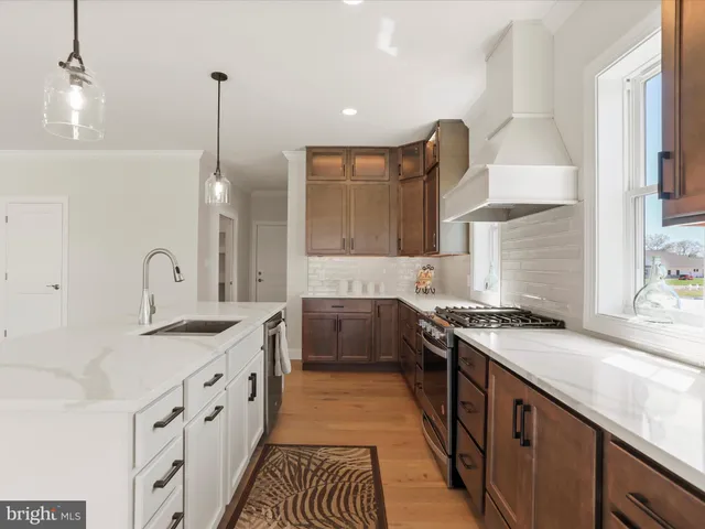 a stove top oven sitting inside of a kitchen