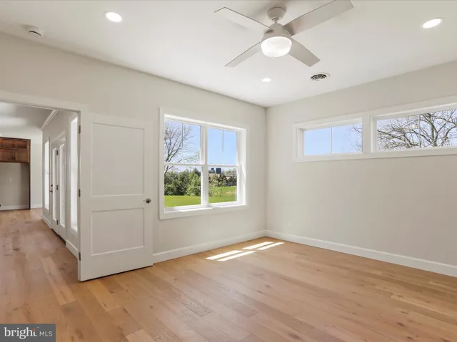 a view of entryway with wooden floor and stairs