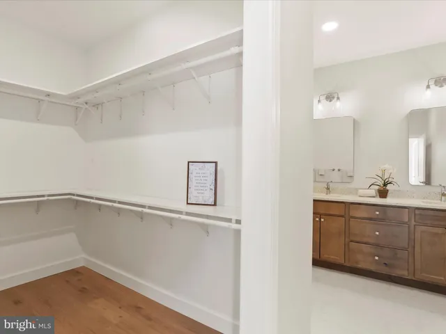 a view of an entryway with wooden floor and windows