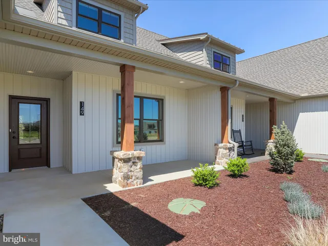 a view of a patio with a table and chairs