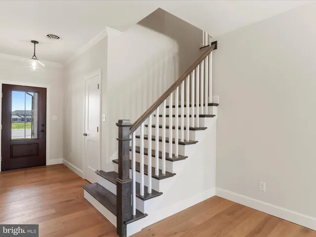 a view of a hallway view with staircase