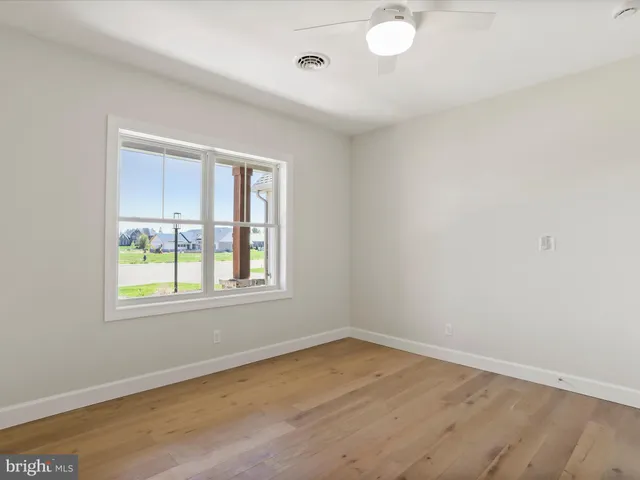 a room with a cabinet and air conditioner vent
