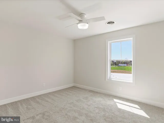 a view of an entryway with a floor to ceiling window