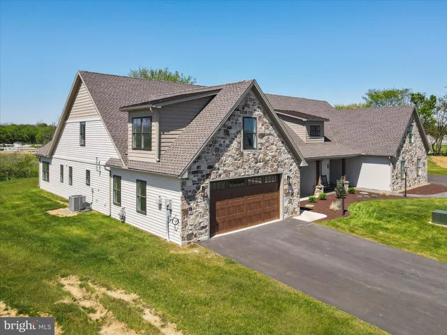 a front view of house with yard and outdoor seating