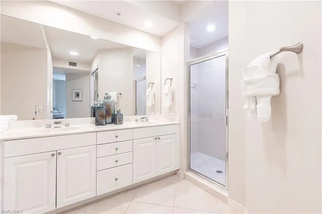 a bathroom with a double vanity sink mirror and double