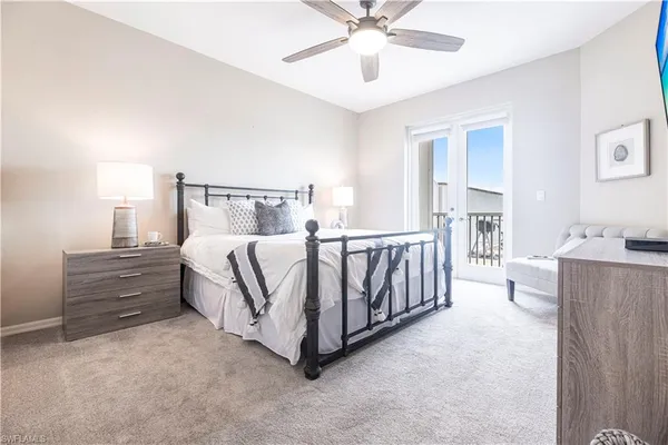 a bed room with a bed and a chandelier