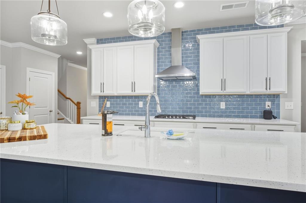 265 Fountain Oak Way Canton, GA 30114 - Photo 12 of 59 a kitchen with a sink cabinets and stainless steel appliances