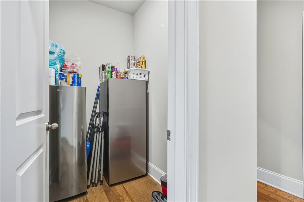 265 Fountain Oak Way Canton, GA 30114 - Photo 16 of 59 a view of walk in closet with clothes and shoes