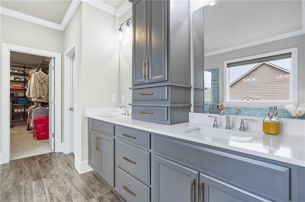 265 Fountain Oak Way Canton, GA 30114 - Photo 29 of 59 a bathroom with a sink and a mirror