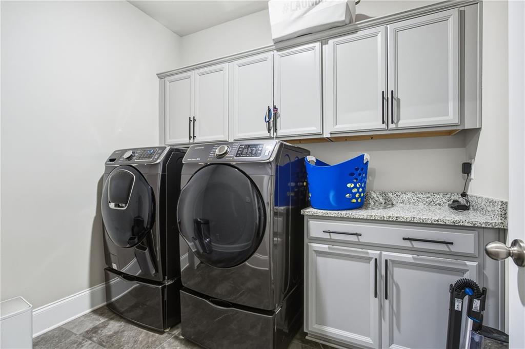 265 Fountain Oak Way Canton, GA 30114 - Photo 31 of 59 a utility room with dryer and washer