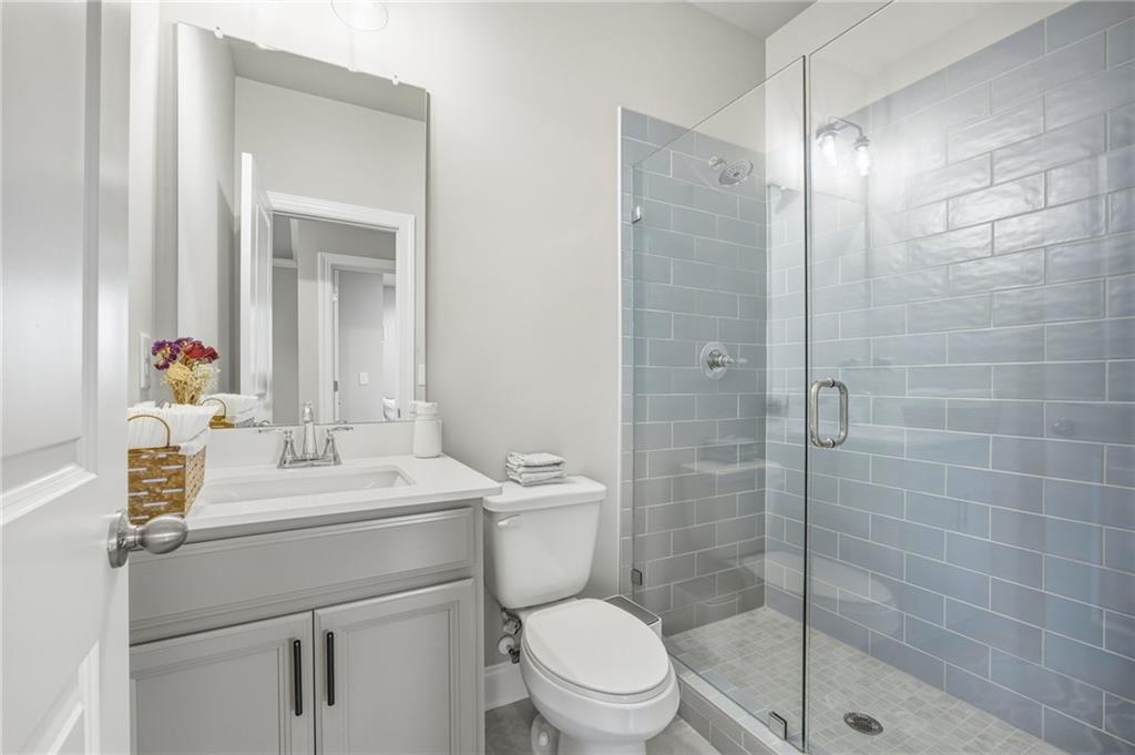 265 Fountain Oak Way Canton, GA 30114 - Photo 33 of 59 a bathroom with a sink a toilet and shower