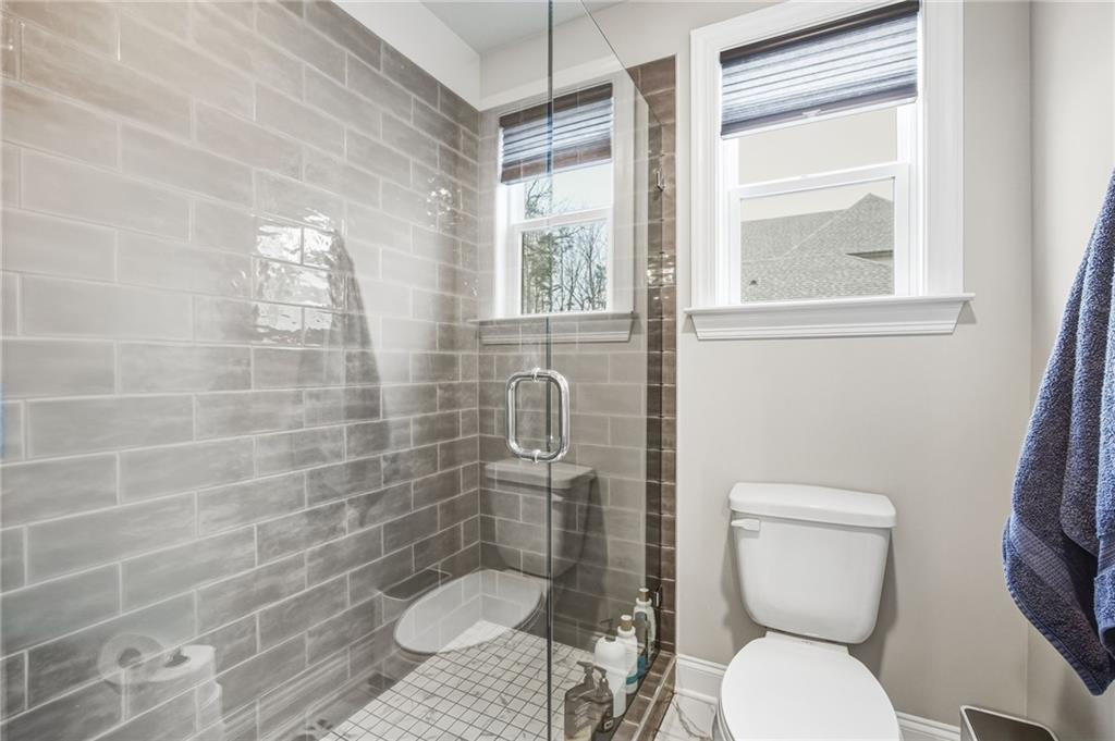 265 Fountain Oak Way Canton, GA 30114 - Photo 44 of 59 a bathroom with a toilet and a shower