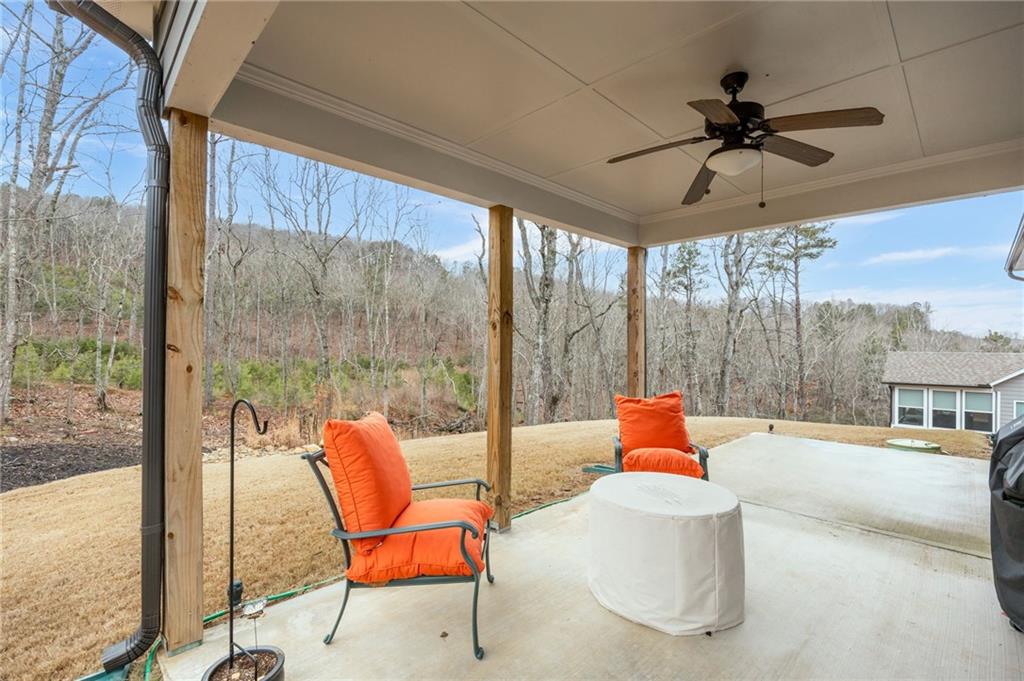 265 Fountain Oak Way Canton, GA 30114 - Photo 46 of 59 a living room with a floor to ceiling window and floor to ceiling window